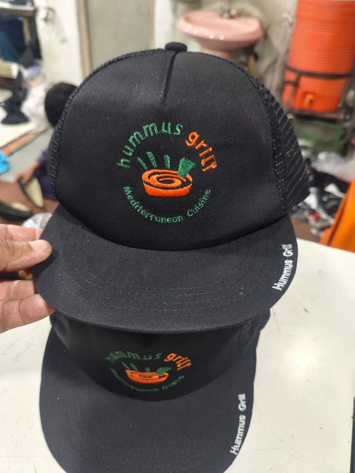 Black Hummus Grill branded cap, supplied product photo